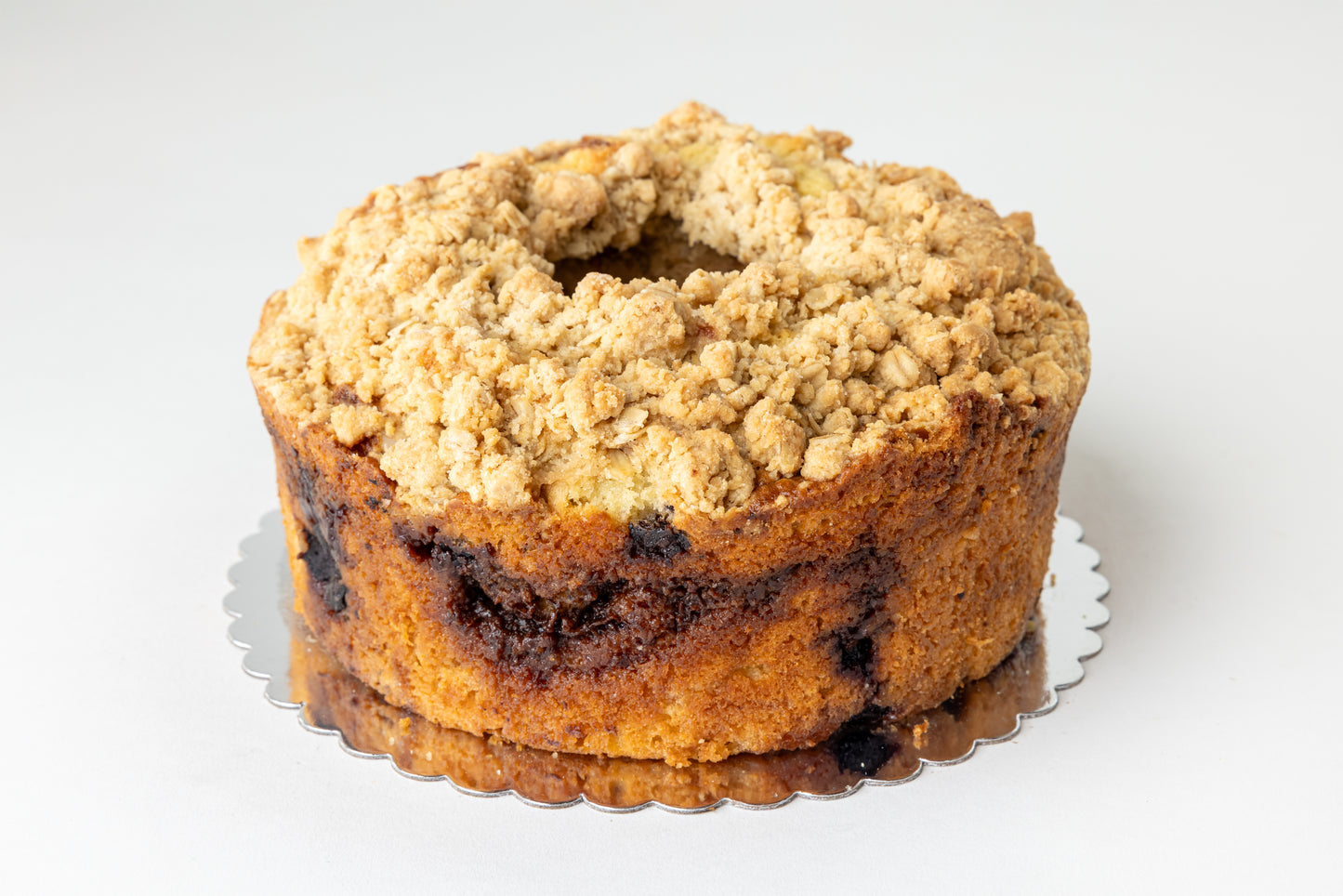 Blueberry coffeecake with crumb topping on a white background