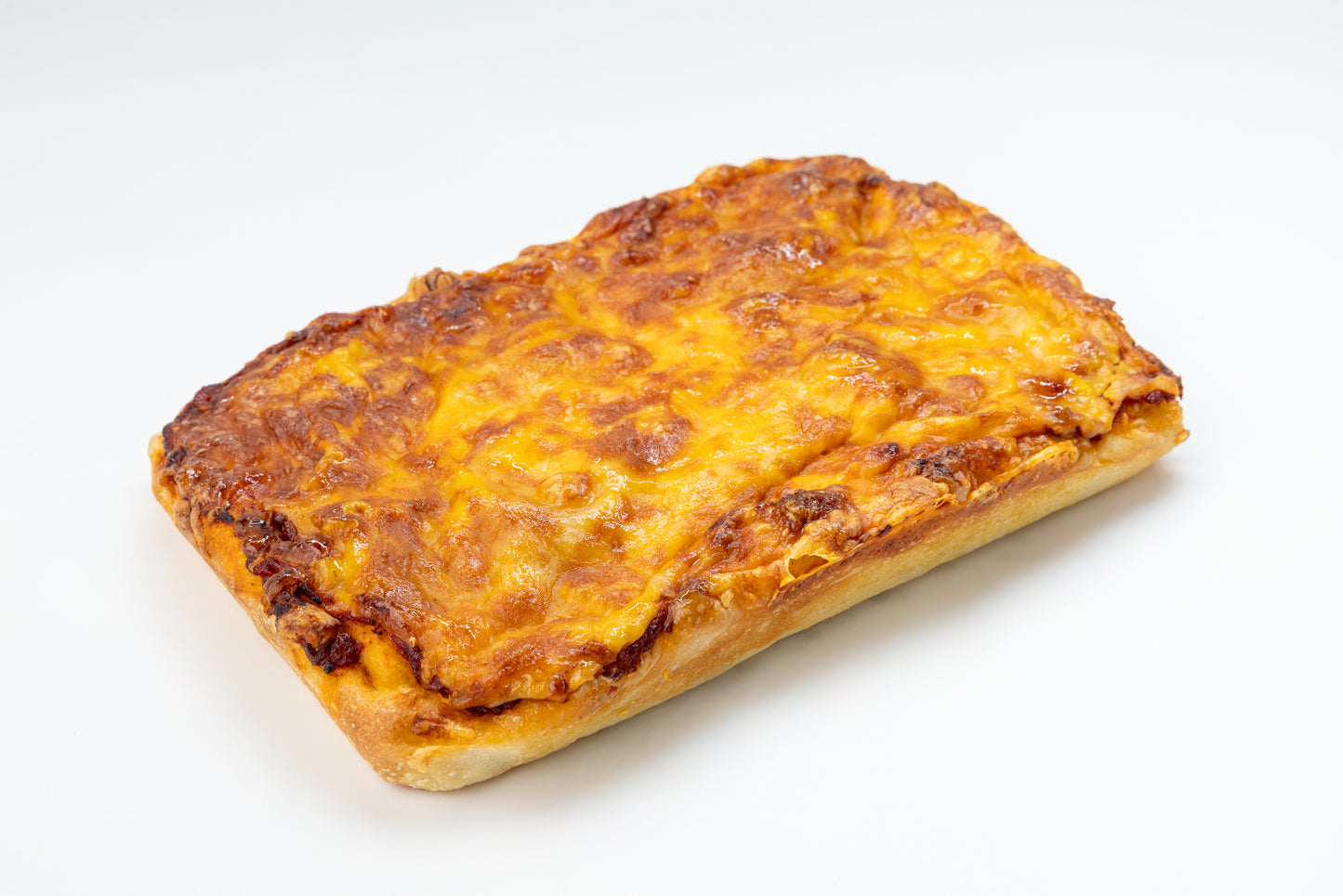 Cheesy rectangular pizza on a white background