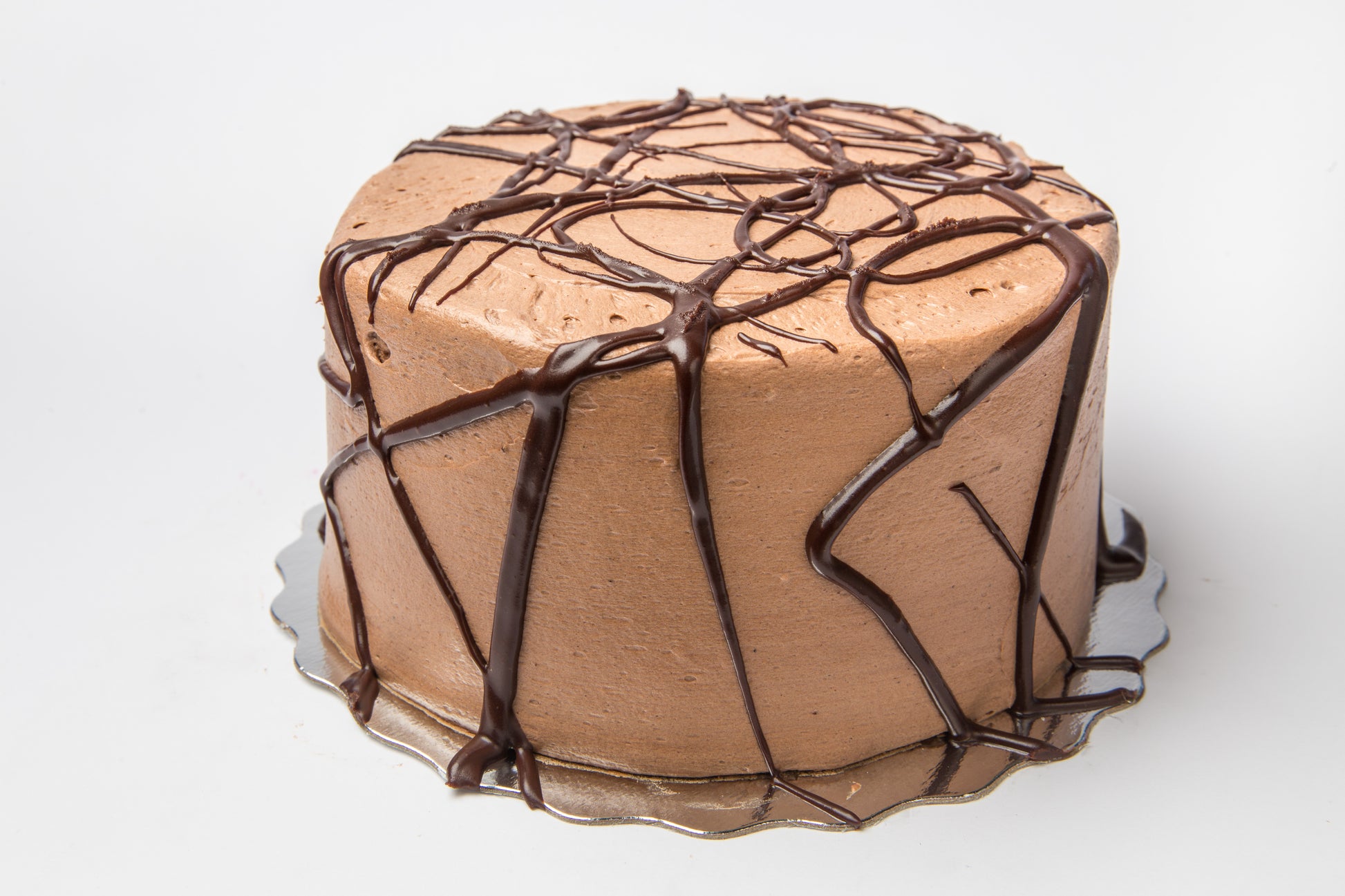 Light Chocolate cake with swirls of dark chocolate on a white background