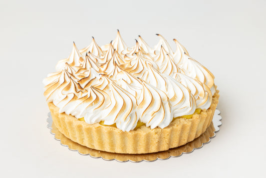Lemon Tart with meringue topping on a white background